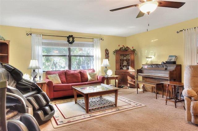 carpeted living room featuring ceiling fan