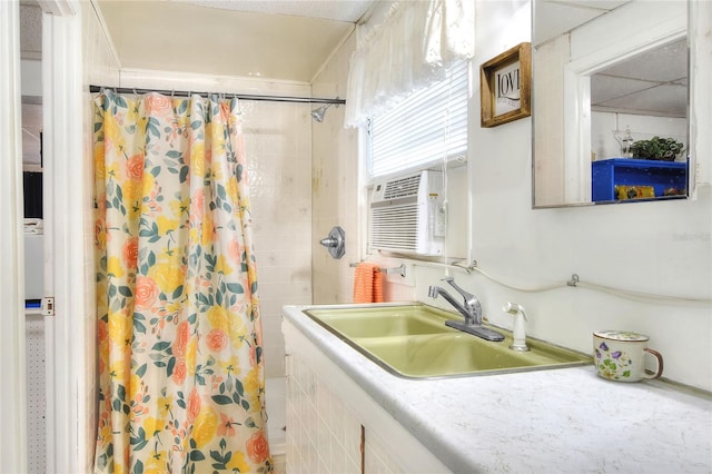 bathroom featuring walk in shower and sink