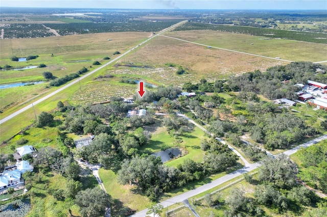 birds eye view of property featuring a rural view