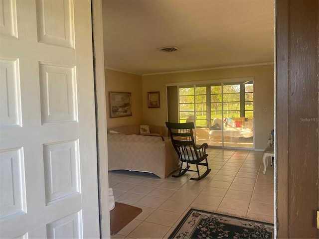 corridor featuring light tile patterned floors and crown molding