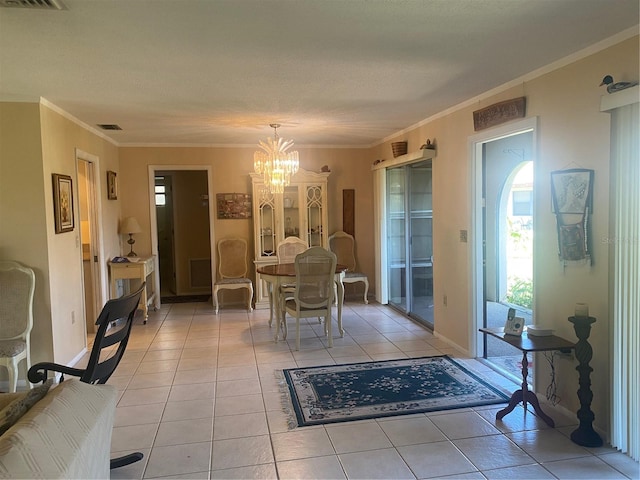 dining area featuring light tile patterned floors, an inviting chandelier, and crown molding