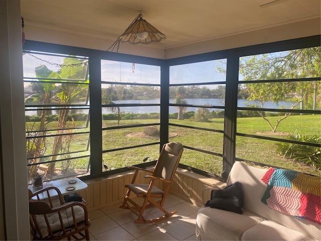 sunroom / solarium with a water view