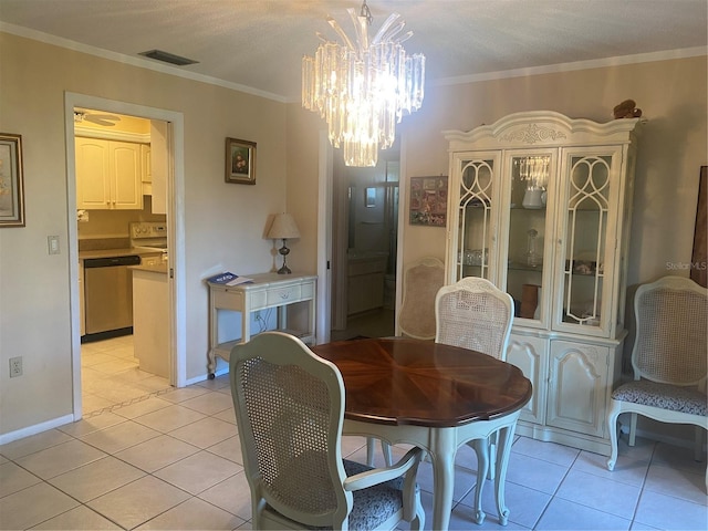 dining space with a notable chandelier, light tile patterned floors, a textured ceiling, and ornamental molding