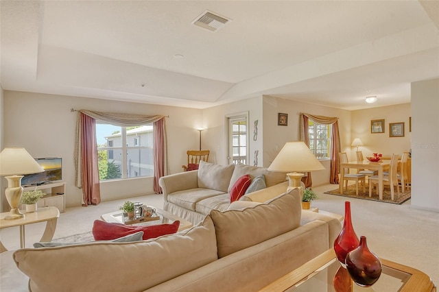 381 Bobby Jones Rd Unit 381, Sarasota, FL 34232 - carpeted living room featuring healthy amount of natural light and a tray ceiling