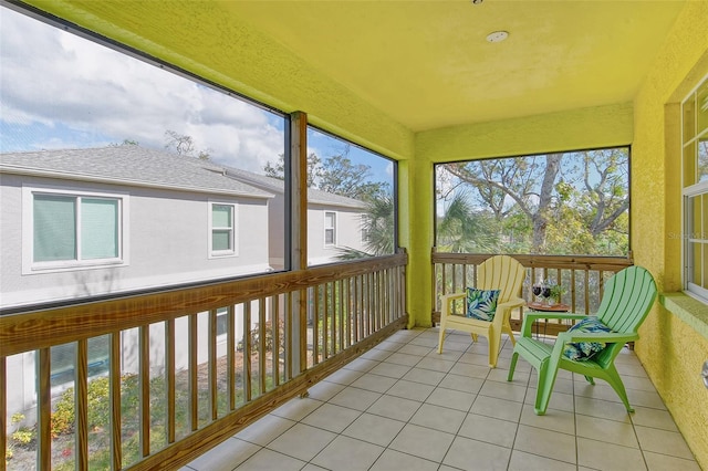 sunroom / solarium featuring plenty of natural light