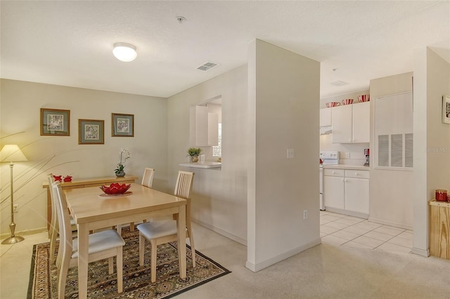 dining area with a textured ceiling