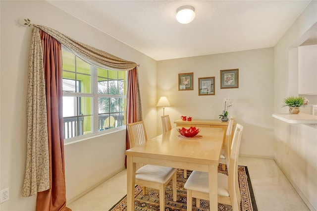 381 Bobby Jones Rd Unit 381, Sarasota, FL 34232 - dining area featuring carpet flooring and baseboards