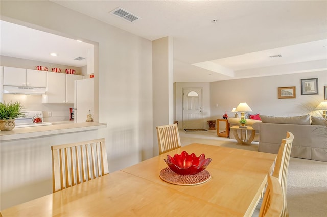 view of carpeted dining space