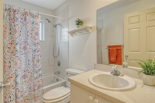 full bathroom with shower / bathtub combination with curtain, vanity, and toilet