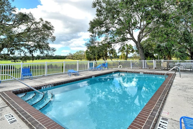 view of swimming pool with a patio