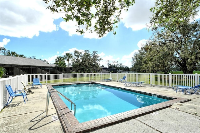 view of swimming pool with a patio