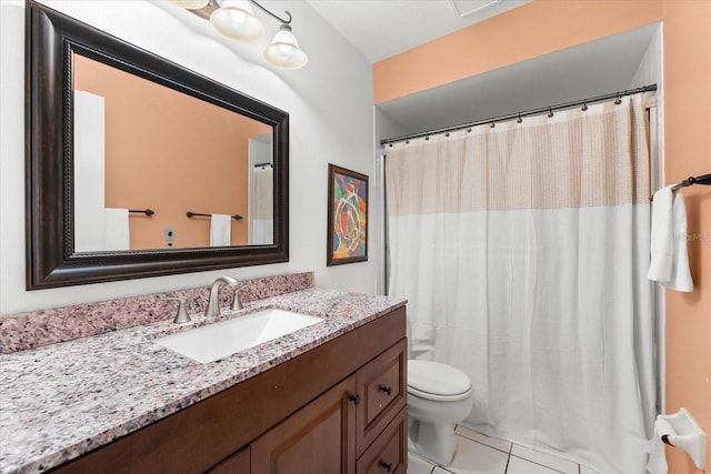 bathroom with vanity, tile patterned floors, and toilet