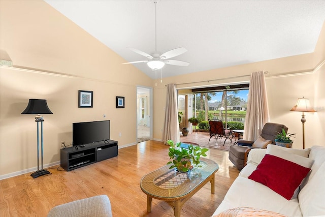 living room featuring high vaulted ceiling, light hardwood / wood-style floors, and ceiling fan