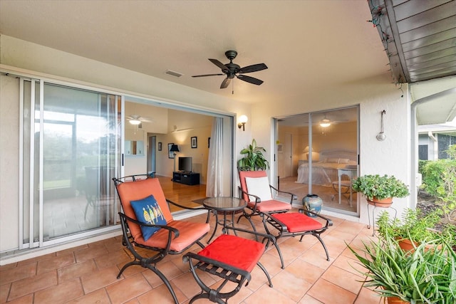 view of patio / terrace featuring ceiling fan