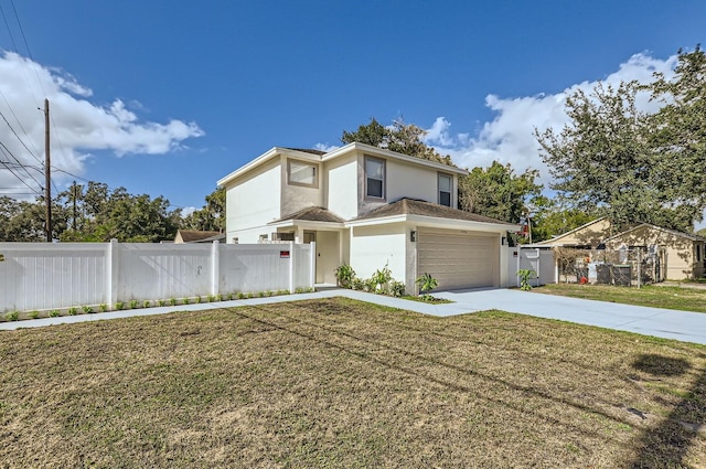 view of front of house featuring a garage and a front lawn