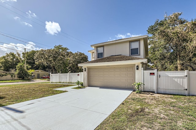 view of front of home with a garage and a front yard