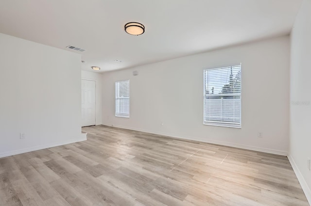 spare room with light hardwood / wood-style floors