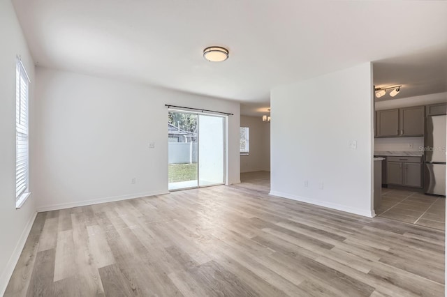 unfurnished room with light hardwood / wood-style floors