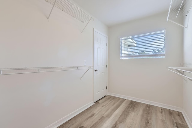 walk in closet featuring light hardwood / wood-style floors