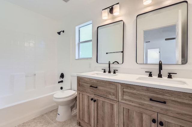 full bathroom with tile patterned floors, vanity, bathtub / shower combination, and toilet