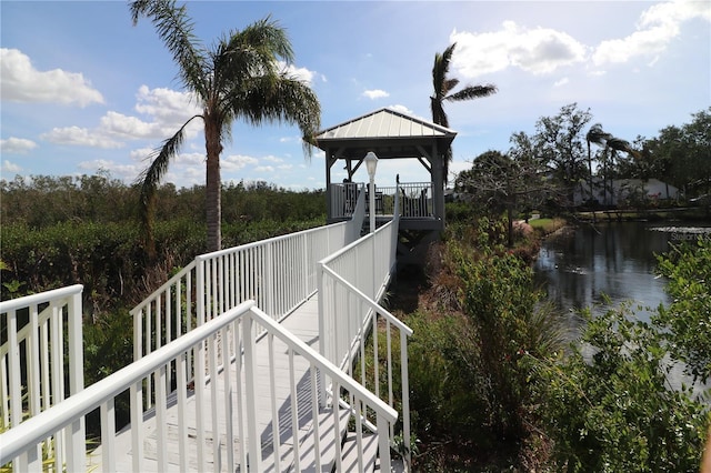 exterior space featuring a gazebo and a water view