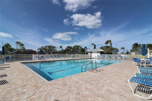 view of swimming pool with a patio