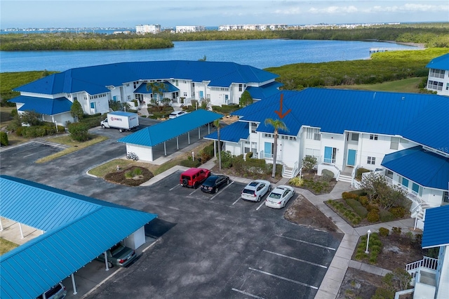 birds eye view of property with a water view