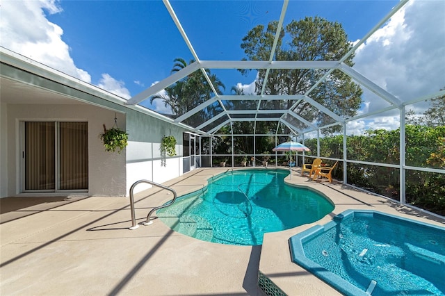 view of swimming pool featuring a lanai and a patio