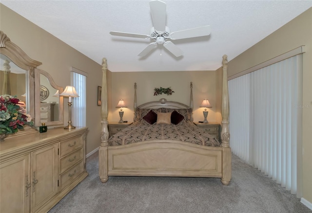 bedroom featuring ceiling fan and light colored carpet