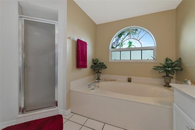 bathroom featuring shower with separate bathtub, vanity, tile patterned floors, and vaulted ceiling