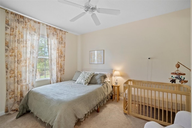 carpeted bedroom featuring ceiling fan