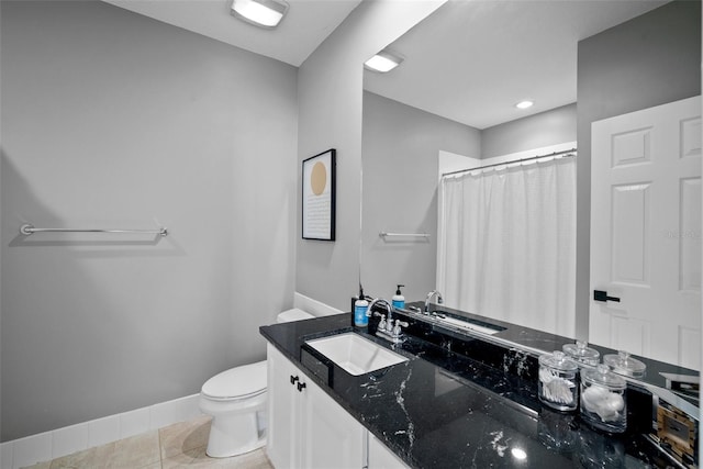 bathroom with vanity, curtained shower, tile patterned floors, and toilet