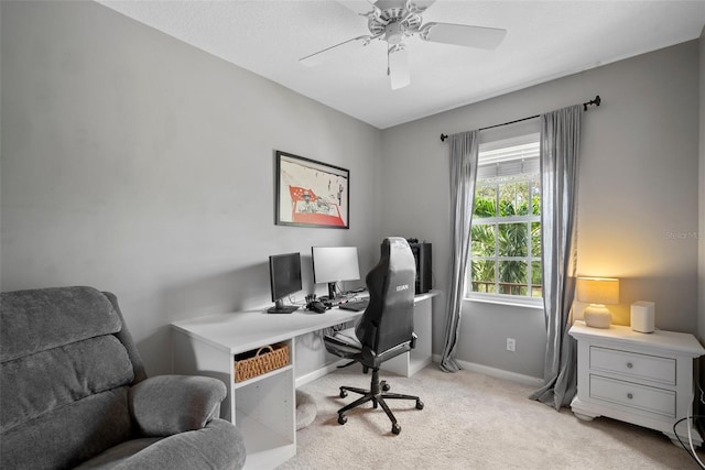 carpeted home office with ceiling fan