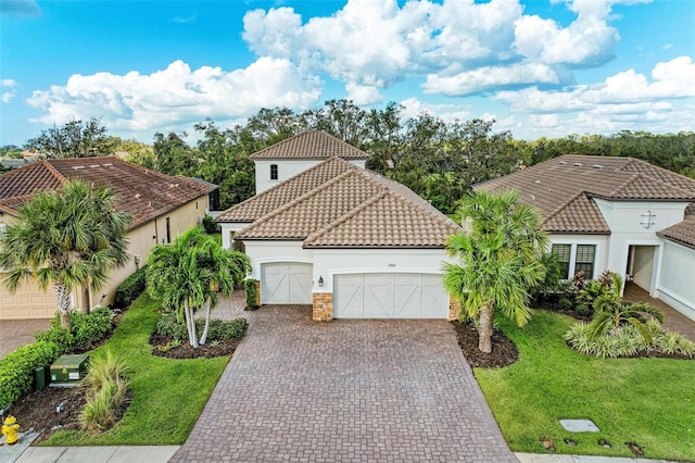 view of front facade with a garage and a front lawn