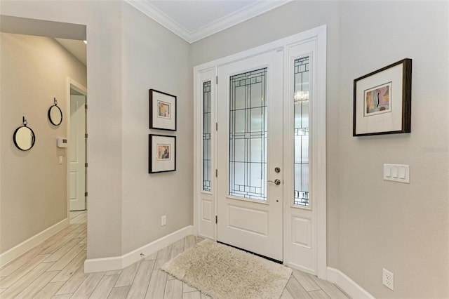 foyer featuring light wood-type flooring and crown molding