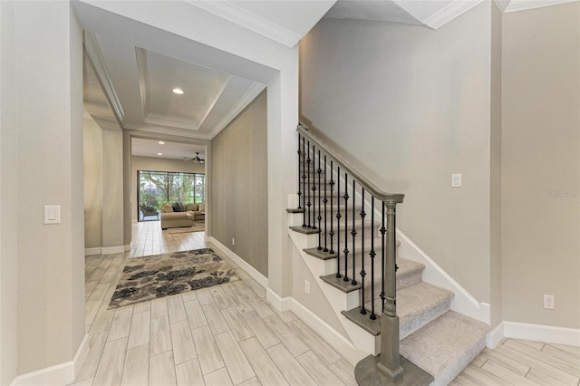 interior space with hardwood / wood-style floors, ceiling fan, and crown molding