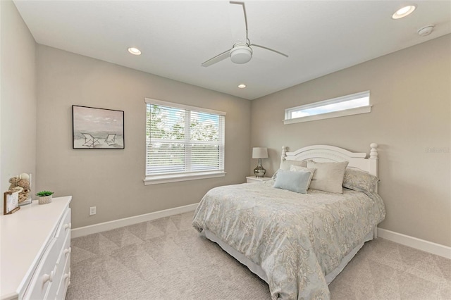 bedroom with light carpet and ceiling fan