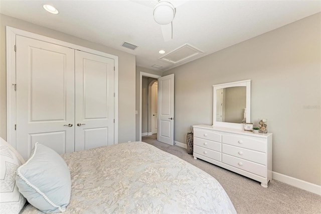 bedroom featuring a closet, light carpet, and ceiling fan