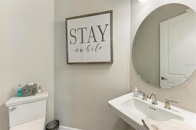 bathroom with sink and toilet