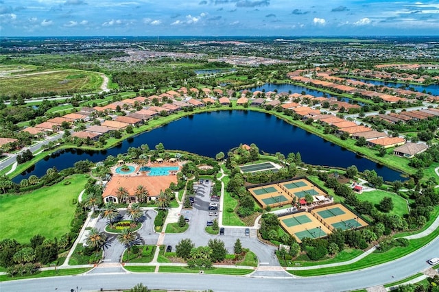 birds eye view of property with a water view