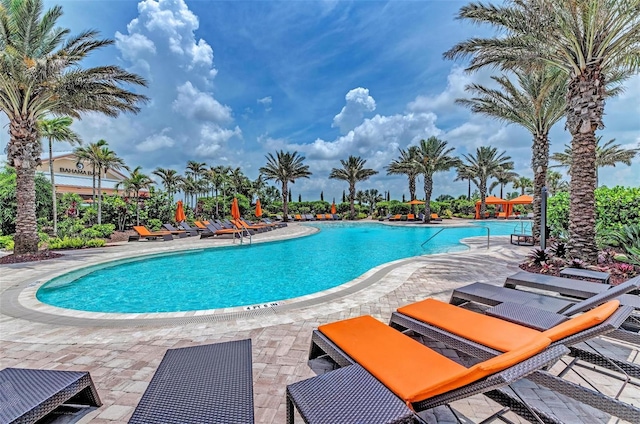 view of swimming pool with a patio area