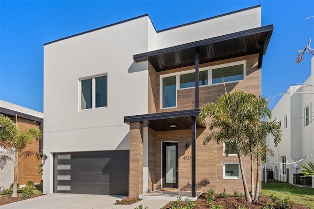 modern home featuring a garage and central AC