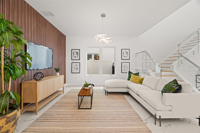 living room with an inviting chandelier