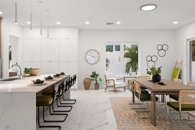 dining space with sink