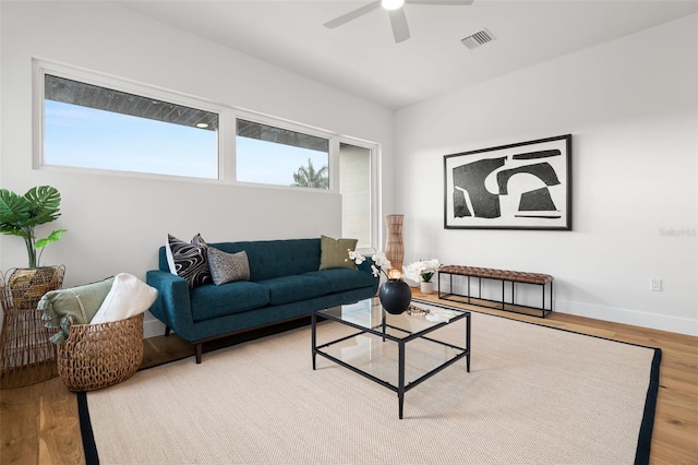 living room with hardwood / wood-style flooring and ceiling fan