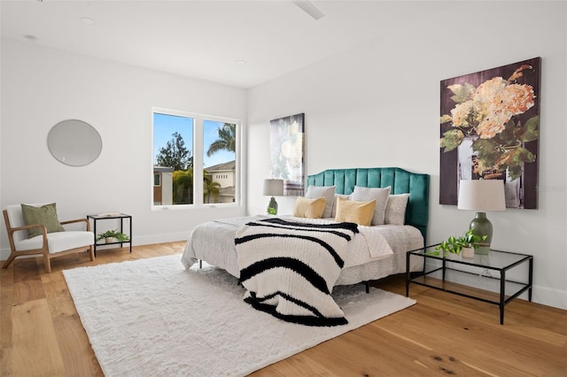 bedroom with wood-type flooring