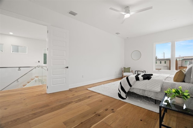 bedroom featuring wood-type flooring and ceiling fan