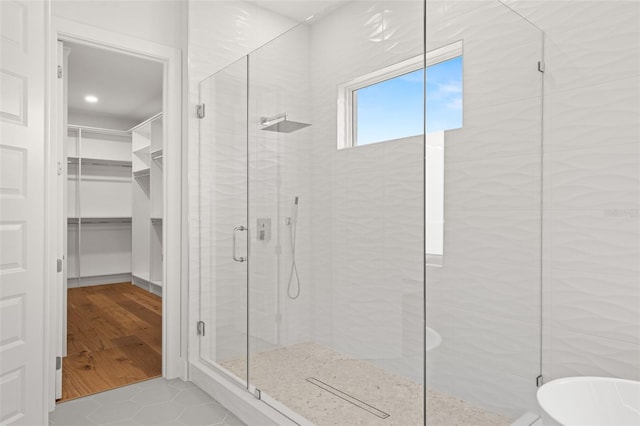 bathroom with plus walk in shower and tile patterned flooring