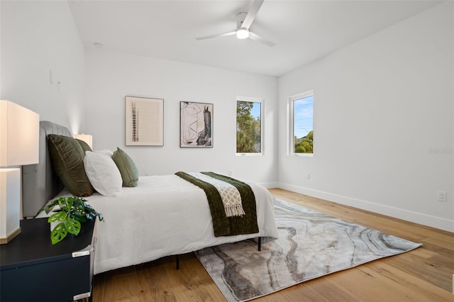 bedroom featuring ceiling fan and wood-type flooring