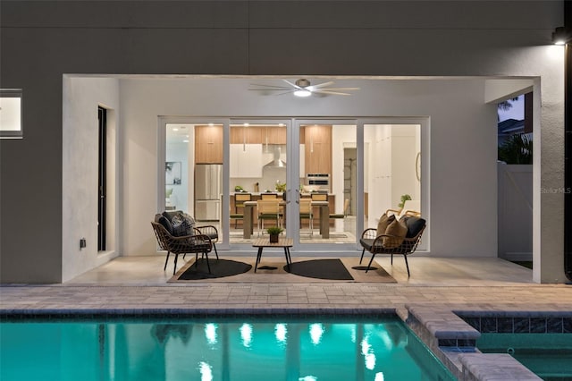 view of pool featuring ceiling fan